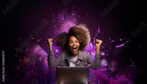 A woman who is excited. You have won a prize. Purple background. Bold colours. Excitement. Celebration. In front of a laptop.