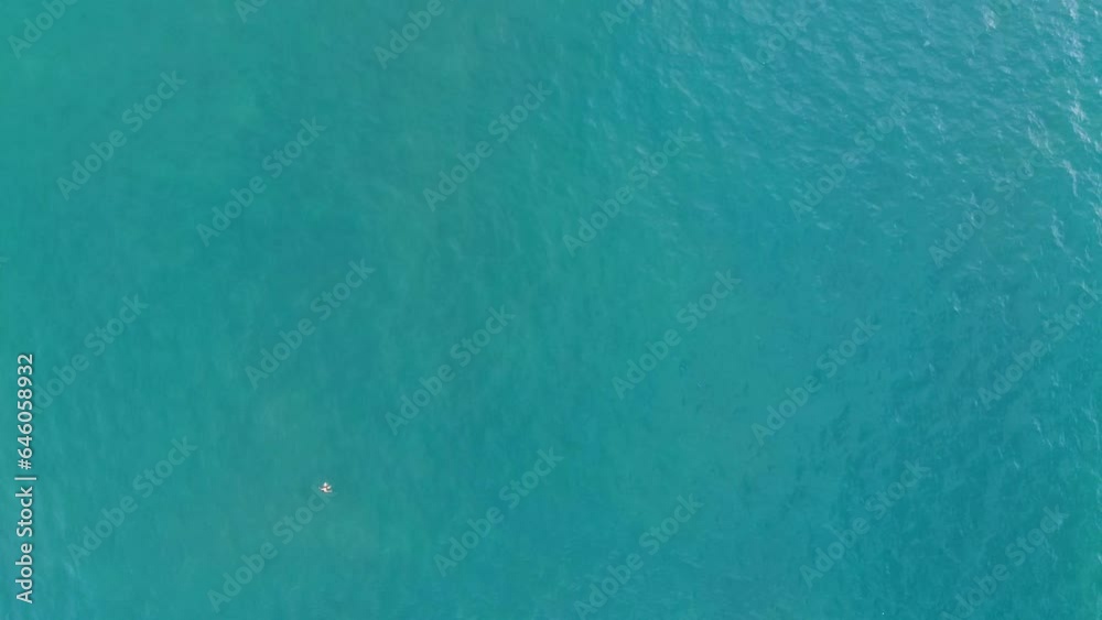 Clear blue sea surface with SUP rowers and fishermen's fishing boats in Da Nang beach, Vietnam. Travel, marine nature. Clear blue sea surface with SUP rowers and fishermen's fishing boats in Da Nang beach, Vietnam. Travel, marine nature.