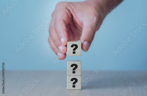 hand holding question mark concept questions and answers Frequently asked questions Frequently asked questions Analysis of the consumer market and competitors
