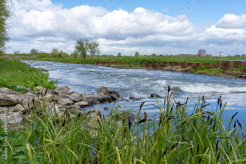 The water of the river De Lek flows over the fish ladder past the Hagestein dam complex photo