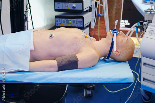 Patient training dummy lying on the operating table at the hospital. Medical background.