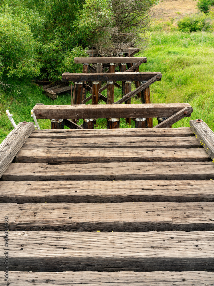 Old wooden bridge partly deconstructed Old wooden bridge partly deconstructed