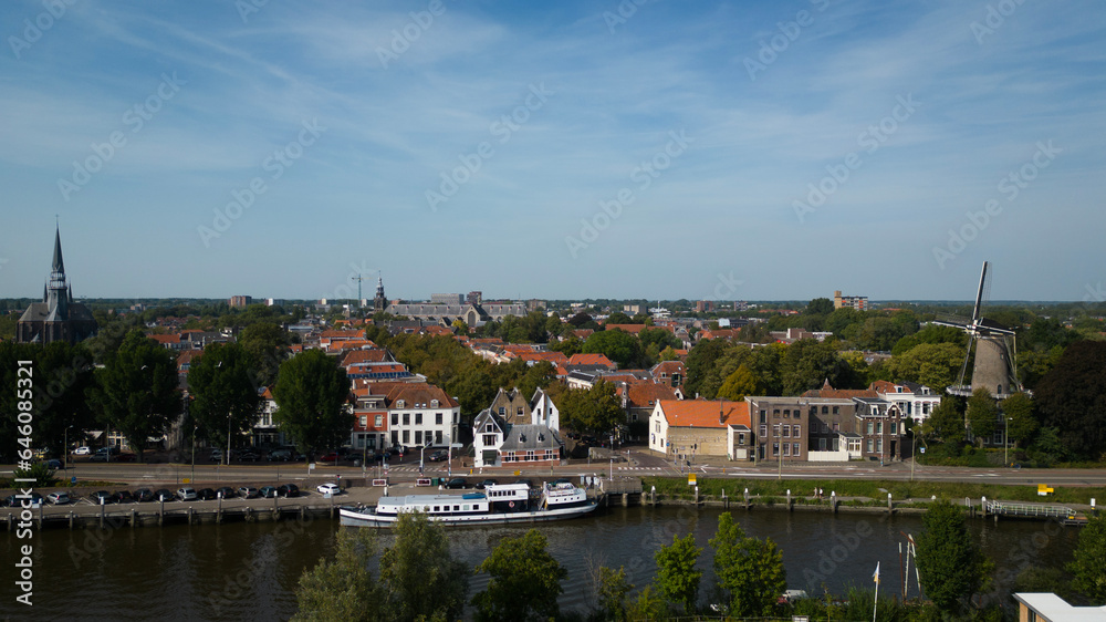 Drone footage of historical Dutch city Gouda. aerial image of Netherlands urban skyline with houses, church and streets