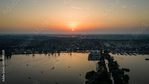 Sun sets on Elfhoeven Reeuwijkse Plassen wetland lake area of the Netherlands photo