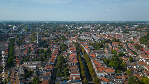 Fototapeta Naklejka Na Ścianę i Meble -  Drone footage of historical Dutch city Gouda. aerial image of Netherlands urban skyline with houses, church and streets