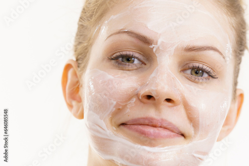 Girl with cream moisture cosmetic on face