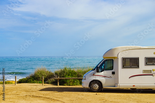 Camper on beach seashore. Holidays trip.