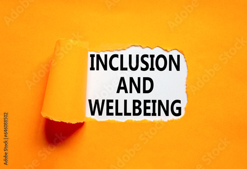 Inclusion and wellbeing symbol. Concept words Inclusion and wellbeing on beautiful white paper. Beautiful orange background. Motivational inclusion and wellbeing concept. Copy space.