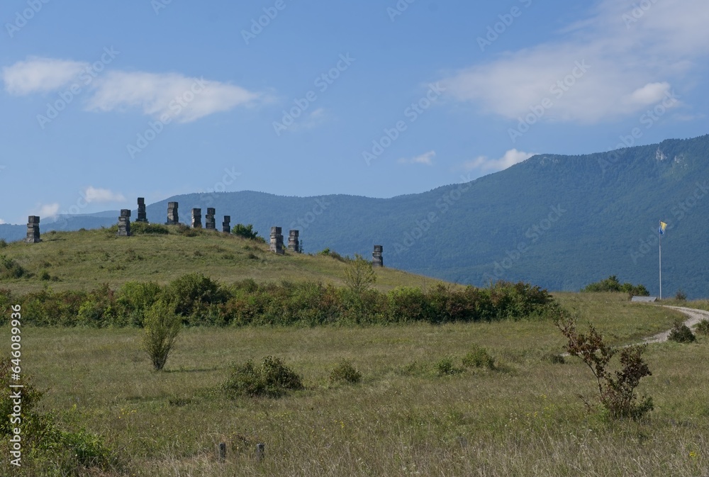 Bihac, Bosnia and Herzegovina - Sep 06, 2023: Serb memorial site. 12,000 to 15,000 Serb civilians were murdered by the Ustasha regime in 1941 in Garavice. Sunny summer day. Selective focus.