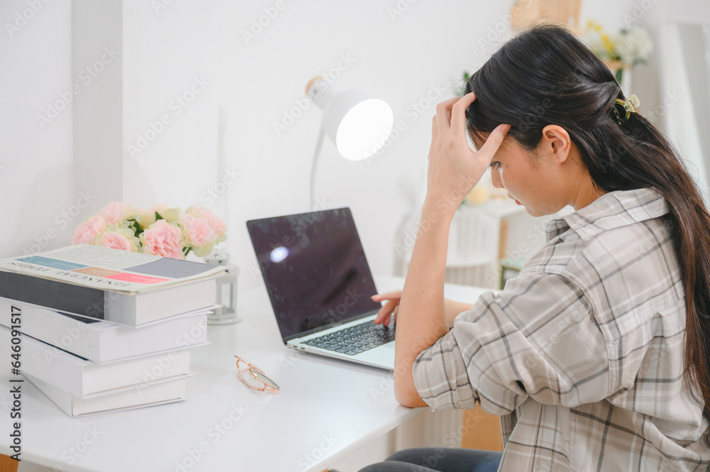 Asian girl overworked feeling tired headache and have eye problems After working on a laptop computer causing neck pain, back pain, shoulder pain or office syndrome. Asian girl overworked feeling tired headache and have eye problems After working on a laptop computer causing neck pain, back pain, shoulder pain or office syndrome.