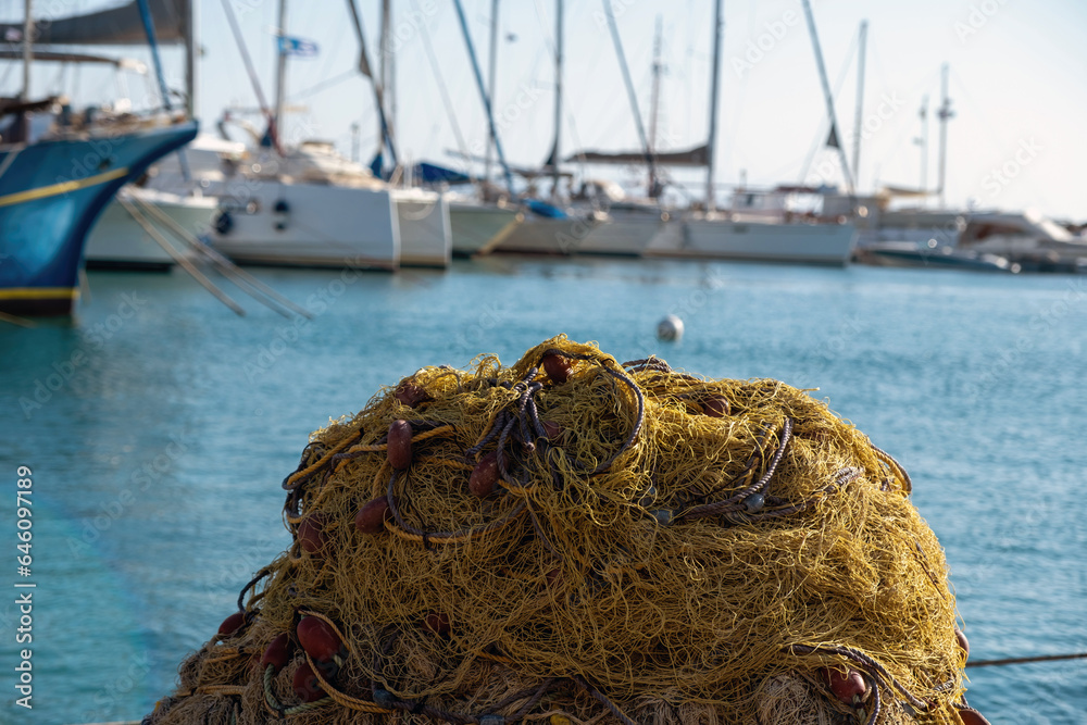 Megalochori, Milos, Miloi port, Greece, Agistri island. Clear view of fishing net, blur background Megalochori, Milos, Miloi port, Greece, Agistri island. Clear view of fishing net, blur background