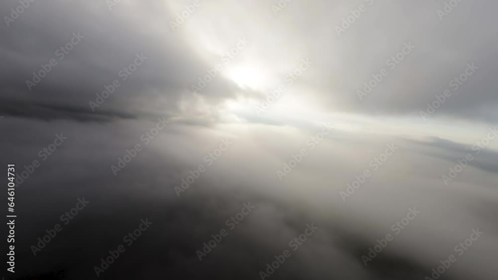 Real flight in the clouds first-person view from the cockpit. Cloud surfing in sunny weather. Aerial view flying through the clouds Real flight in the clouds first-person view from the cockpit. Cloud surfing in sunny weather. Aerial view flying through the clouds