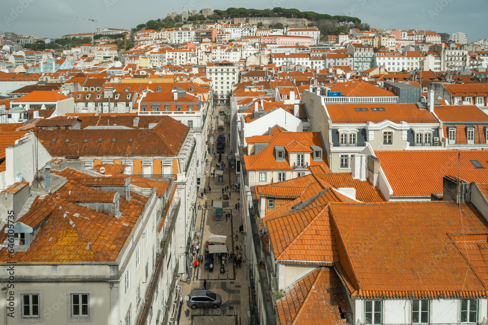 Lisbon, Portugal cityscape with historic Sao Jorge Castle and old town at sunset