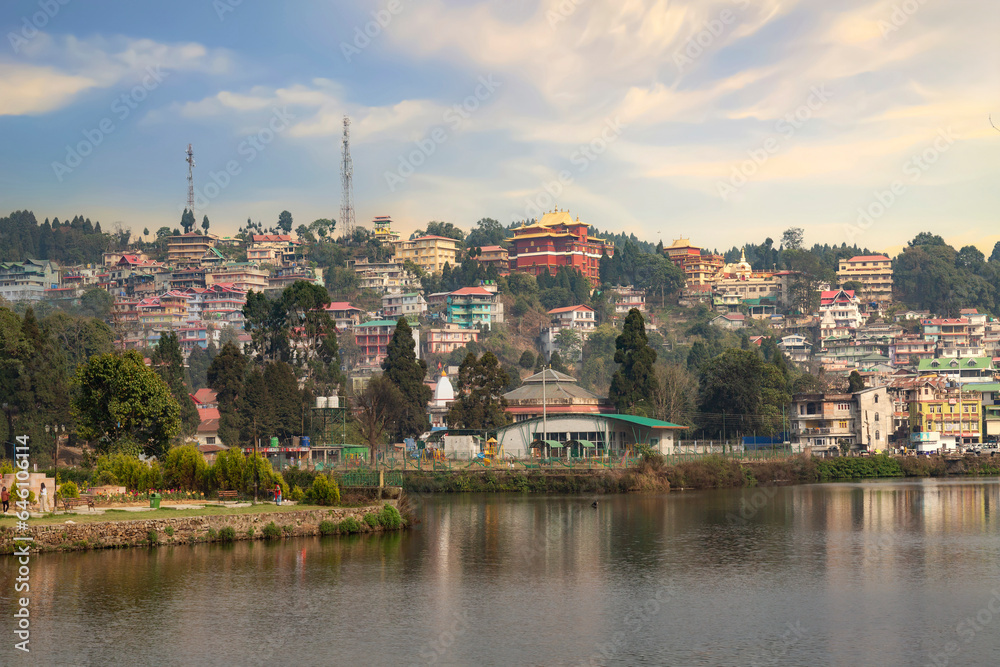 Naklejka premium Mirik lake with its cityscape at sunset. Mirik is a popular tourist destination in Darjeeling district of West Bengal, India.