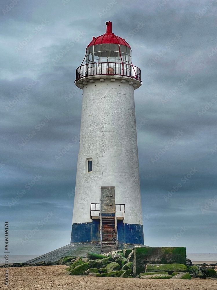 Atmospheric abandoned lighthouse on the Welsh coast by the sea