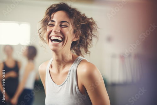 Portrait of happy young woman in gym