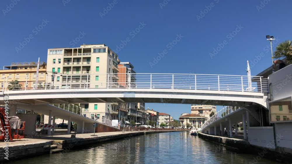Viareggio harbor view of city and canal with bridge in port of Viareggio, Lucca, Tuscany, Italy. Sailing along city. Viareggio harbor view of city and canal with bridge in port of Viareggio, Lucca, Tuscany, Italy. Sailing along city.