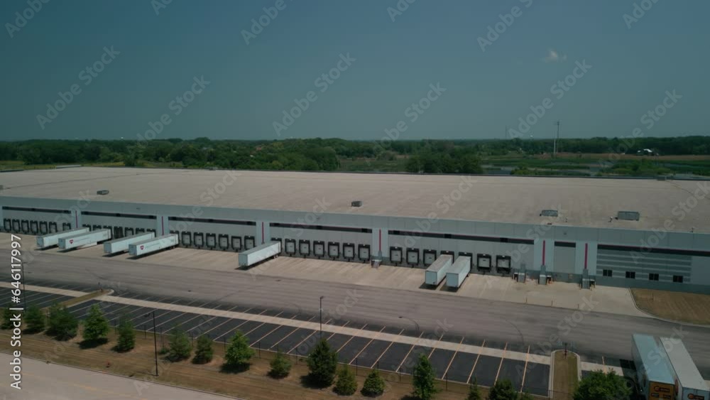 Warehouse with semi trucks and cargo trailers, aerial view. Warehouse with semi trucks and cargo trailers, aerial view.