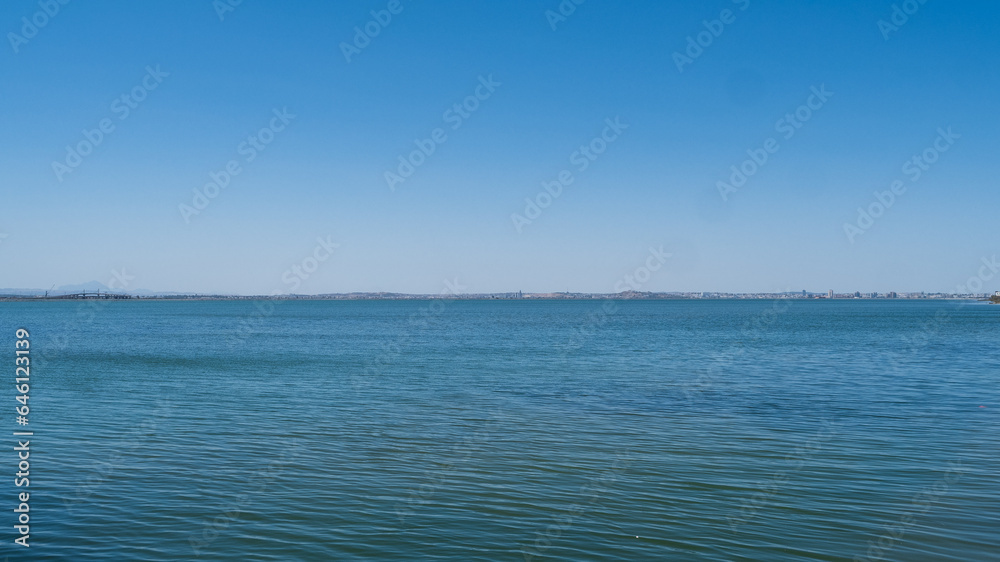 View of the Mediterranean coast from a boat, clean blue sky, outdoor life.
