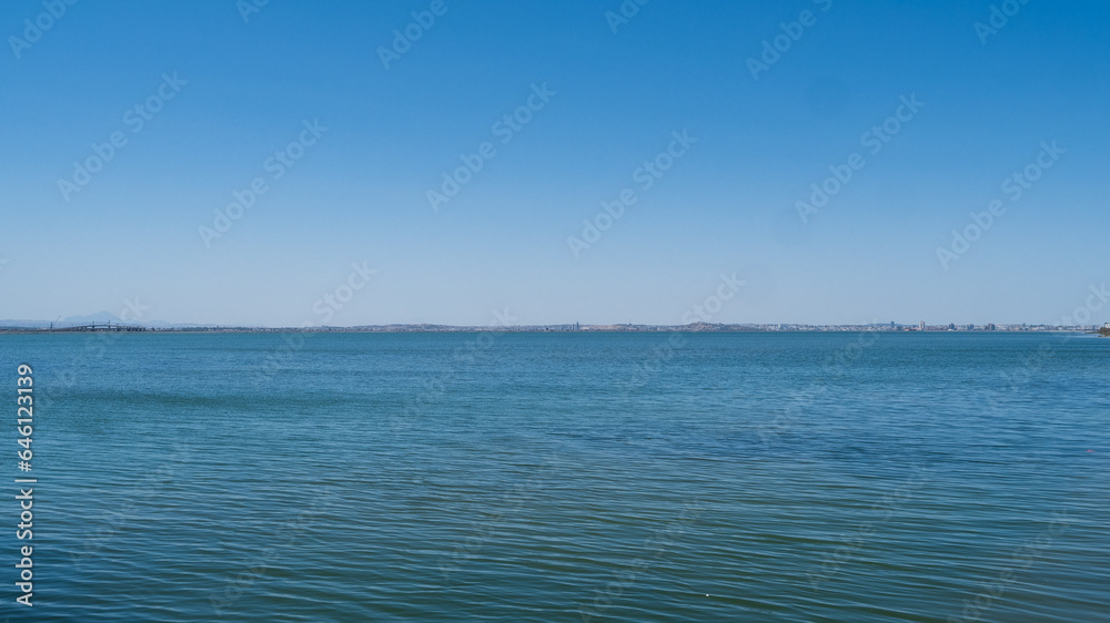View of the Mediterranean coast from a boat, clean blue sky, outdoor life. View of the Mediterranean coast from a boat, clean blue sky, outdoor life.
