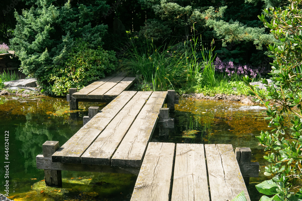 zigzag bridge over a pond in a Japanese garden zigzag bridge over a pond in a Japanese garden