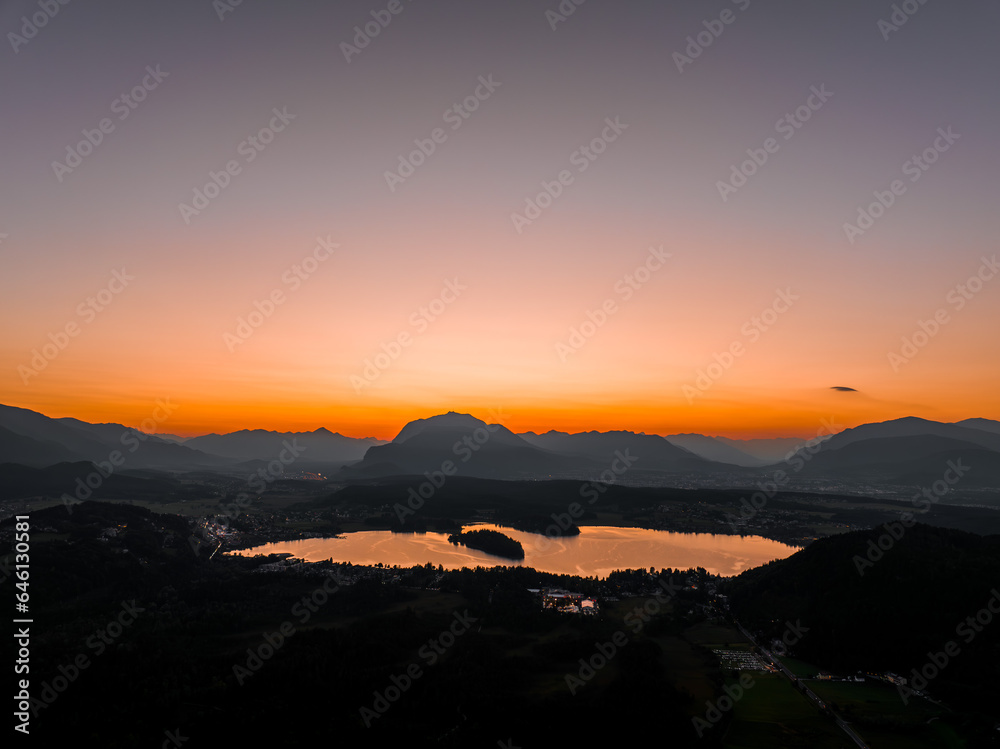 Sunset on Faakersee with Dobratsch in the background Sunset on Faakersee with Dobratsch in the background