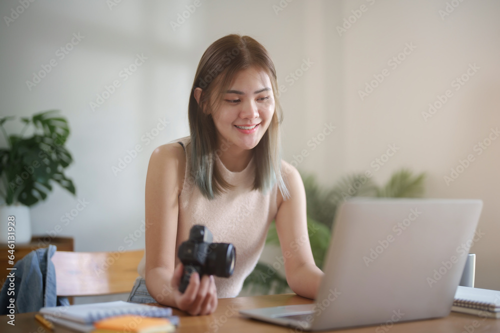 Creative photographer working with laptop in studio. Creative photographer working with laptop in studio.