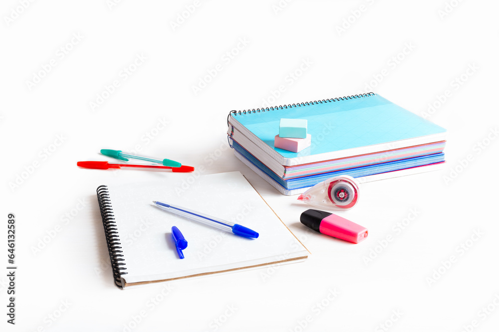 Still life with a white background of school supplies for the long-awaited return to school. Still life with a white background of school supplies for the long-awaited return to school.