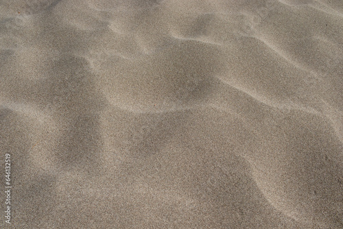 natural sandy beach texture, close-up, background © Hatice