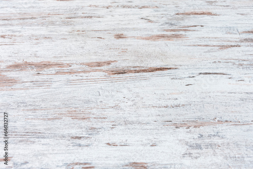 Texture of wooden table surface, aged white paint, scratch and wear marks.