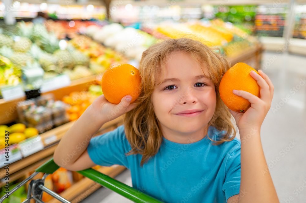 Child with shopping basket full of vegetables and fruits. Kid in a food store. Supermarket shopping and grocery shop concept. Child with shopping basket. Child with shopping basket full of vegetables and fruits. Kid in a food store. Supermarket shopping and grocery shop concept. Child with shopping basket.