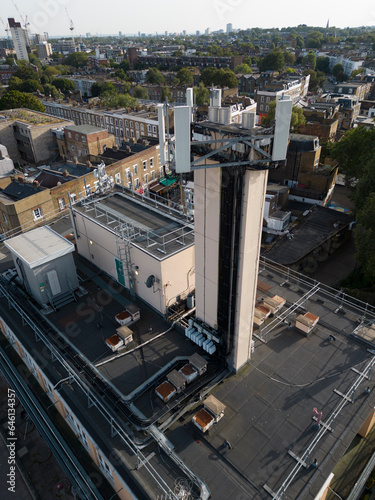 A rooftop EE 4G and 5G Mobile phone cell  mast on top of a public library in North London, UK.
