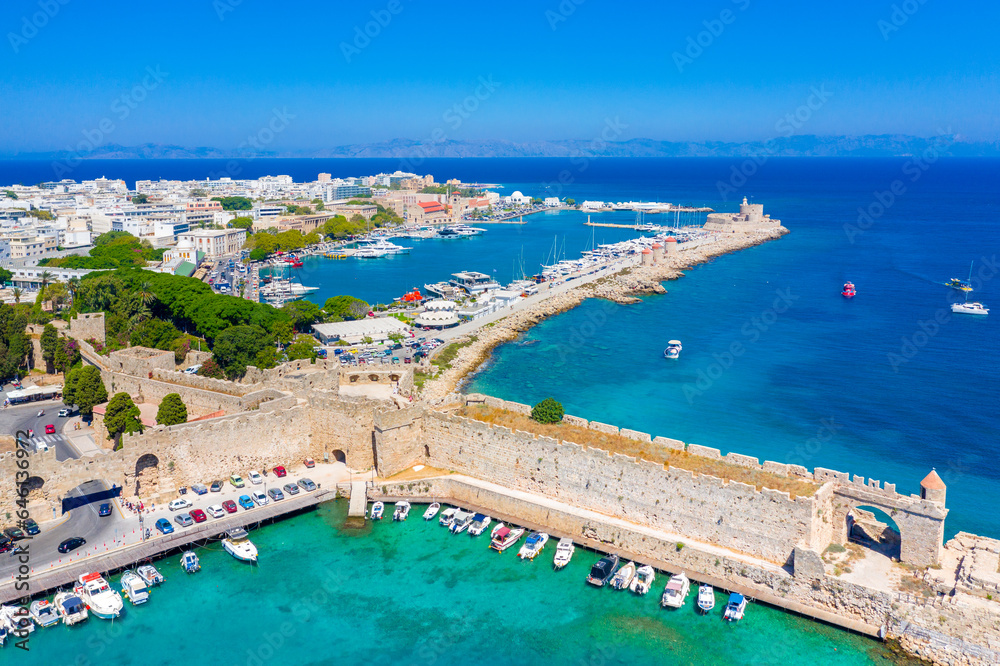 Fototapeta premium Mandraki port with fort of St. Nicholas and windmills, Rhodes, Greece. 