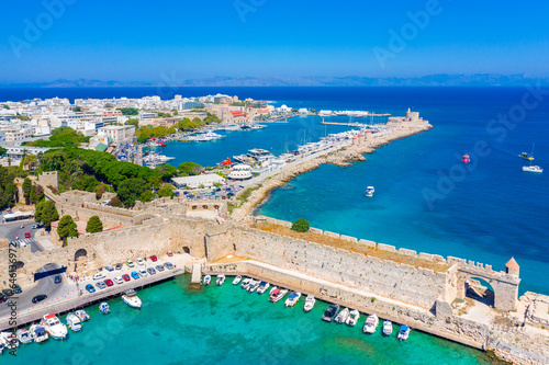 Mandraki port with fort of St. Nicholas and windmills, Rhodes, Greece. 