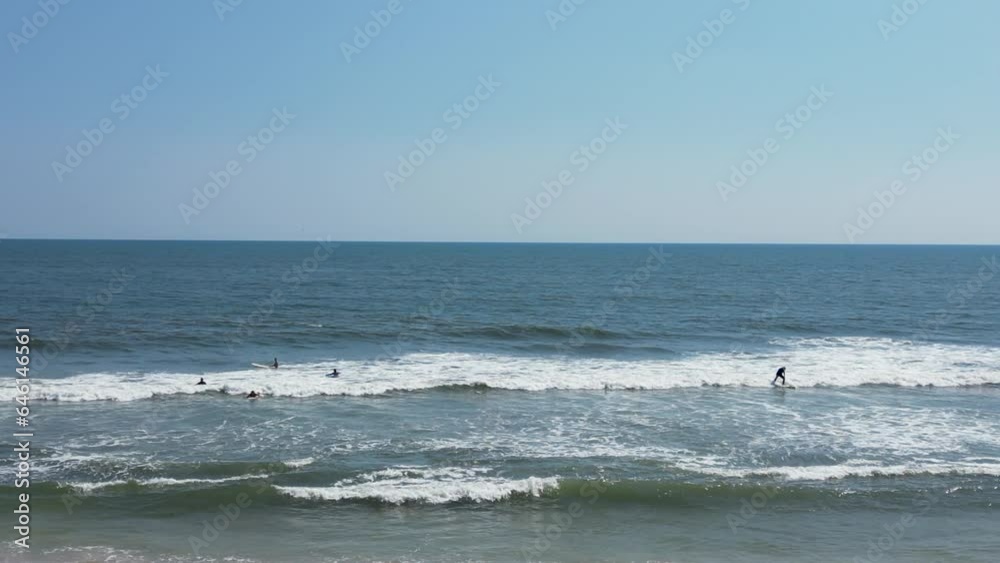 Drone view looking at surfers in the water at Gilgo Beach Long Island New York. Drone view looking at surfers in the water at Gilgo Beach Long Island New York.
