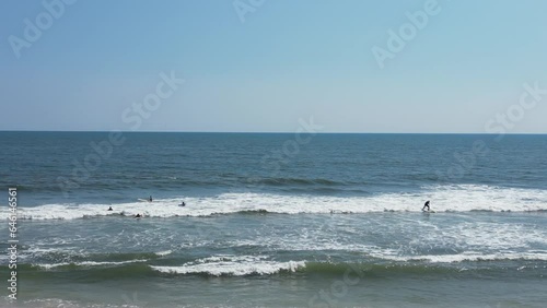 Drone view looking at surfers in the water at Gilgo Beach Long Island New York. photo