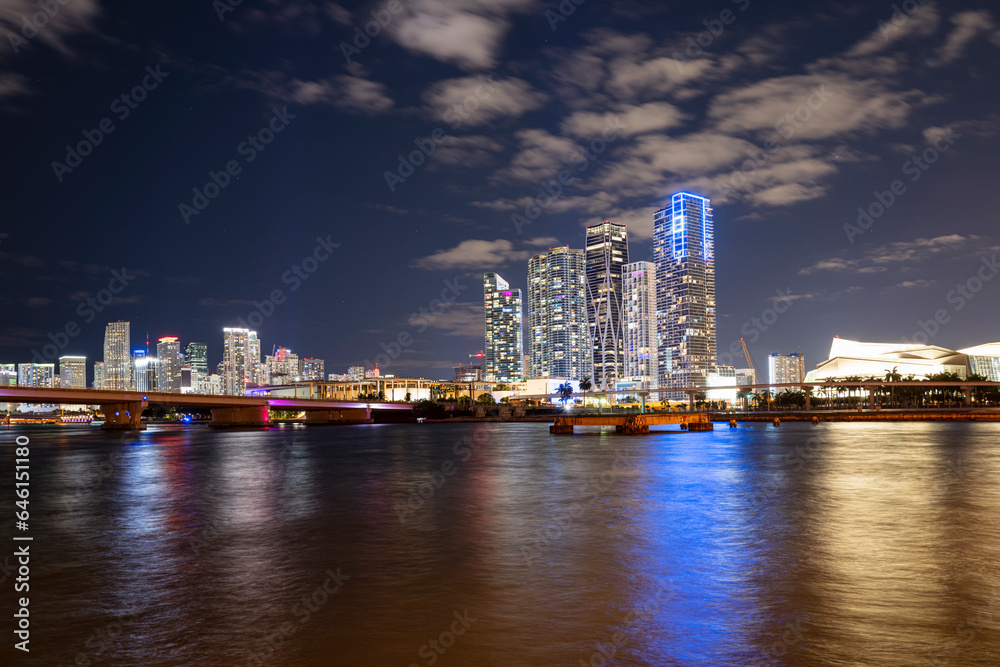 Night panoramic photo of Miami landscape. Bayside Marketplace Miami Downtown behind MacArthur Causeway from Venetian Causeway. Night panoramic photo of Miami landscape. Bayside Marketplace Miami Downtown behind MacArthur Causeway from Venetian Causeway.