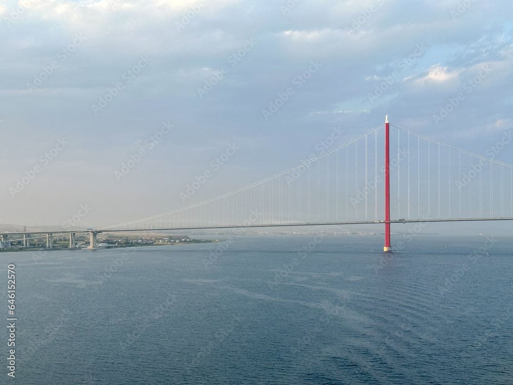 Istanbul, Turkey - July 22,2023: Turkey's 1915 suspension bridge over the Dardanelles Straight seen from the water

