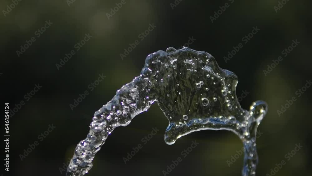 The stream of water rises to the top. Slow motion video of water flow. Fountain. The stream of water rises to the top. Slow motion video of water flow. Fountain.