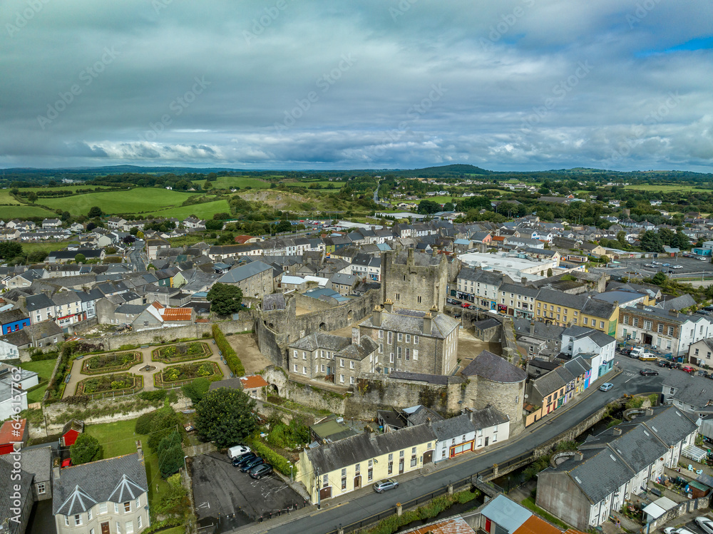 Aerial view of Roscrea town and castle in Central Ireland with medieval keep, semicircular defensive tower