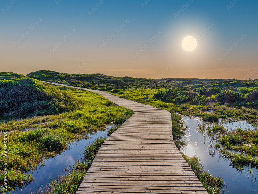 Wooden walkway at Slangkop Lighthouse during sunset, Kommetjie, Cape Town, South Africa