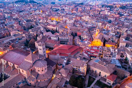 Photography Aerial view of historic district of Vic town with ancient cathedral on winter twilight, Catalonia, Spain