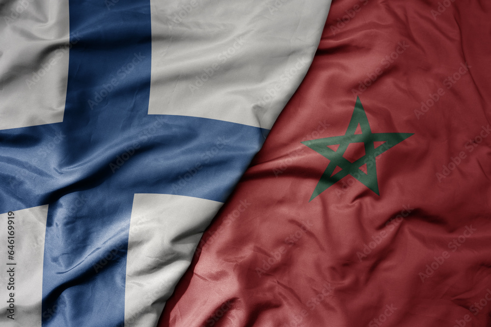 big waving national colorful flag of finland and national flag of morocco . big waving national colorful flag of finland and national flag of morocco .