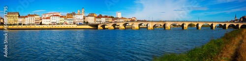 Panorama of bridge over Saona and loire river and riverside of Macon, France photo