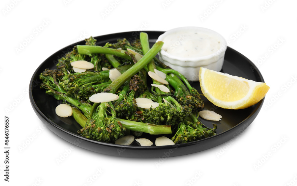 Tasty cooked broccolini with almonds, lemon and sauce isolated on white Tasty cooked broccolini with almonds, lemon and sauce isolated on white