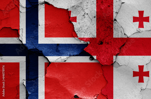 flags of Norway and Georgia painted on cracked wall