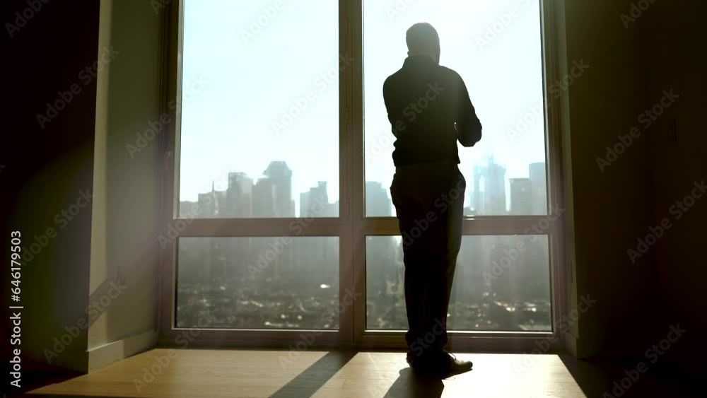 Businessman Starting To Work in Modern Office Opening Window Blinds Businessman Starting To Work in Modern Office Opening Window Blinds