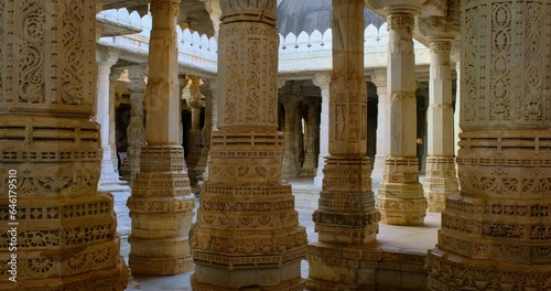Columns of beautiful Ranakpur Jain temple or Chaturmukha Dharana Vihara. Marble ancient medieval carved sculpture carvings of sacred religious place of jainism worship. Ranakpur, Rajasthan. India photo