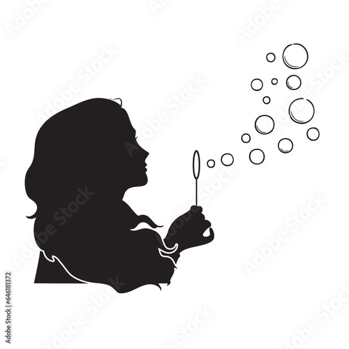 Woman blowing soap bubbles photo