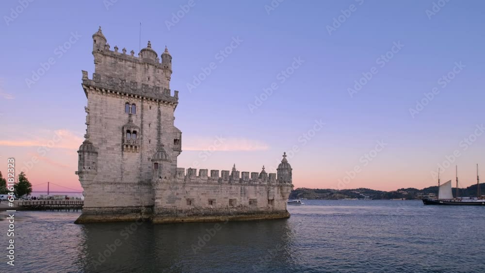 Belem Tower or Tower of St Vincent, famous tourist landmark of Lisboa and tourism attraction, on the bank of the Tagus River (Tejo) with tourist boats after sunset in dusk twilight. Lisbon, Portugal Belem Tower or Tower of St Vincent, famous tourist landmark of Lisboa and tourism attraction, on the bank of the Tagus River (Tejo) with tourist boats after sunset in dusk twilight. Lisbon, Portugal